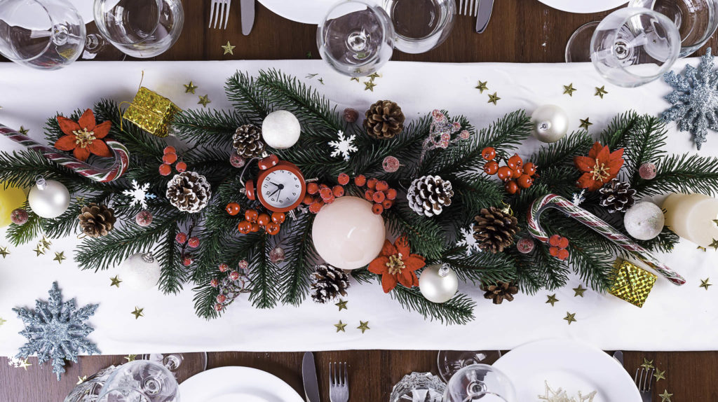 Christmas table setting with christmas decoration on dark wooden table, flat lay