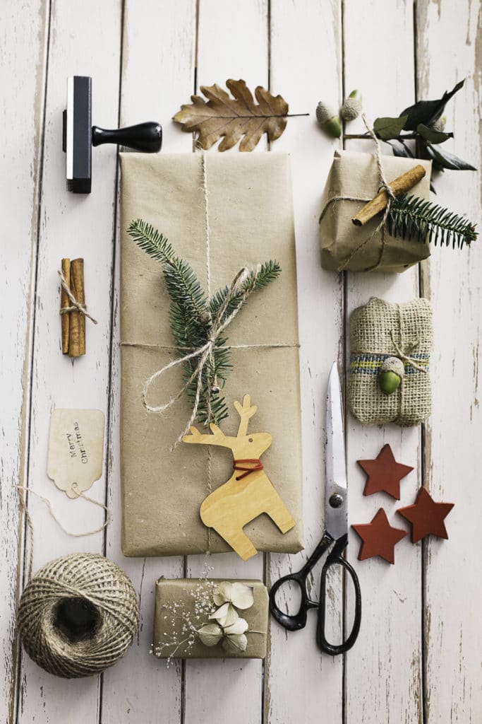 101 Holiday Gift Wrapping Ideas To Make Your Christmas Bright - A Bunch Of Different Items That Are On A Table - Stock Photography