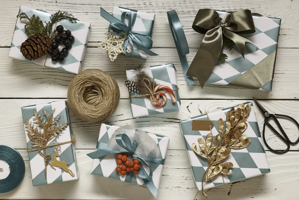 101 Holiday Gift Wrapping Ideas To Make Your Christmas Bright - A Group Of Items On A Table - Typeface